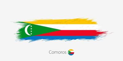 drapeau de comores, grunge abstrait brosse accident vasculaire cérébral sur gris Contexte. vecteur