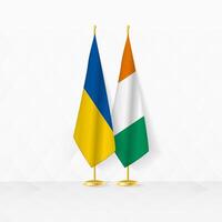 Ukraine et Ivoire côte drapeaux sur drapeau rester, illustration pour diplomatie et autre réunion entre Ukraine et Ivoire côte. vecteur