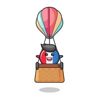 mascotte du drapeau de la france chevauchant une montgolfière vecteur