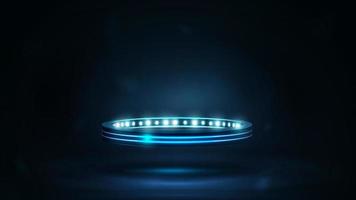 anneau numérique avec lumières dans une pièce sombre. podium néon bleu brillant en forme d'anneau