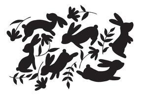 silhouettes de Pâques lapins et fleurs. vecteur noir et blanc dessin