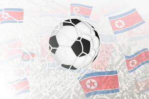 nationale Football équipe de Nord Corée marqué but. Balle dans objectif filet, tandis que Football partisans sont agitant le Nord Corée drapeau dans le Contexte. vecteur