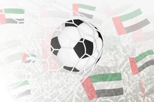 nationale Football équipe de uni arabe émirats marqué but. Balle dans objectif filet, tandis que Football partisans sont agitant le uni arabe émirats drapeau dans le Contexte. vecteur