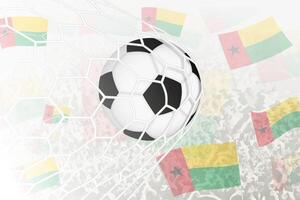 nationale Football équipe de guinée-bissau marqué but. Balle dans objectif filet, tandis que Football partisans sont agitant le guinée-bissau drapeau dans le Contexte. vecteur