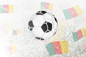 nationale Football équipe de Cameroun marqué but. Balle dans objectif filet, tandis que Football partisans sont agitant le Cameroun drapeau dans le Contexte. vecteur