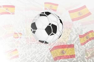 nationale Football équipe de Espagne marqué but. Balle dans objectif filet, tandis que Football partisans sont agitant le Espagne drapeau dans le Contexte. vecteur