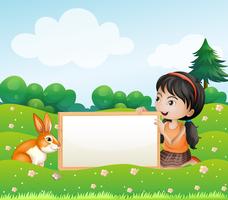 Une fille tenant un tableau vide avec un lapin vecteur