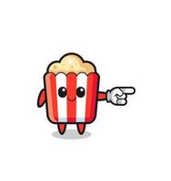 mascotte de pop-corn avec le geste droit de pointage vecteur