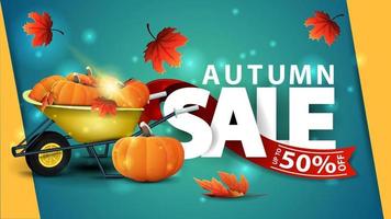 vente d'automne, bannière web verte avec brouette de jardin avec une récolte de citrouilles et de feuilles d'automne vecteur