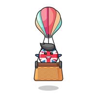 mascotte du drapeau du royaume-uni chevauchant une montgolfière vecteur