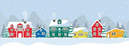 ensemble de maisons colorées. rouge, orange, vert, bleu maison des habitants du groenland, de l'islande, du pôle nord, de la hollande. toit et fenêtres enneigés, extérieur du nouvel an. arbre de noël dans la cour