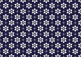 blanc symbole fleurs sur foncé bleu arrière-plan, ethnique en tissu sans couture modèle conception pour chiffon, tapis, batique, fond d'écran, emballage etc. vecteur