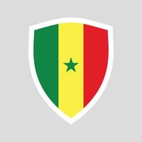 Sénégal drapeau dans bouclier forme Cadre vecteur