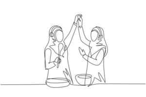 une ligne continue dessinant deux femmes arabes souriant et dansant avec une poêle à frire et une spatule à la main tout en cuisinant ensemble dans la cuisine à la maison. illustration graphique de vecteur de conception de dessin à une seule ligne
