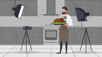 un homme cuisinier dans la cuisine a un blog culinaire. le gars dans le tablier de cuisine tient du poulet frit. vecteur. vecteur