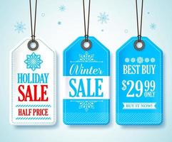 étiquettes de vente d'hiver définies pour les promotions saisonnières des magasins suspendues sur fond de neige avec des couleurs bleu et blanc. illustration vectorielle. vecteur