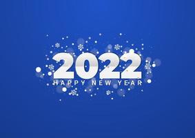 Fond de bonne année 2022. en-tête de calendrier numéro 2022 avec des flocons de neige et des particules de paillettes floues sur fond bleu vecteur