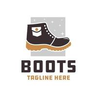 logo de mode de bottes de montagne vecteur