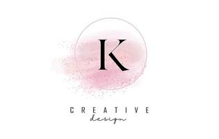 création de logo de lettre k avec cadre rond pailleté et fond aquarelle rose. vecteur