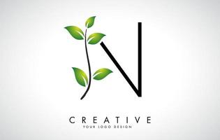 création de logo feuille lettre n avec des feuilles vertes sur une branche. lettre n avec le concept de la nature. vecteur