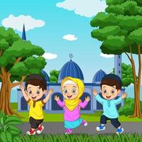 joyeux dessin animé enfant musulman devant le fond de la mosquée vecteur