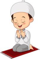 dessin animé musulman petit garçon priant vecteur