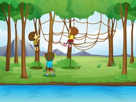 Enfants grimper à la corde dans la forêt vecteur
