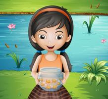 Une jeune fille souriante tenant un aquarium vecteur