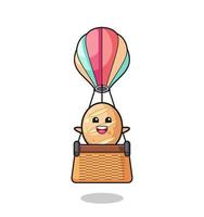mascotte de pain français chevauchant une montgolfière vecteur