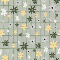 motif naïf sans couture aléatoire avec des fleurs abstraites de camomille. ornement floral aux couleurs orange et vert sur fond quadrillé gris. vecteur