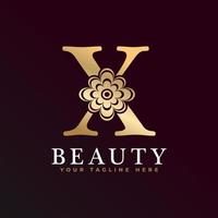 élégant x logo de luxe. logo alphabet floral doré avec des feuilles de fleurs. parfait pour la mode, les bijoux, le salon de beauté, les cosmétiques, le spa, la boutique, le mariage, le timbre de lettre, le logo de l'hôtel et du restaurant. vecteur