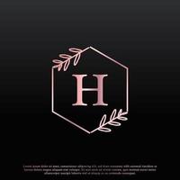 élégant logo floral hexagonal de lettre h avec une ligne de branche de monogramme de feuille élégante créative et une couleur noire rose. utilisable pour les logos d'affaires, de mode, de cosmétiques, de spa, de science, de médecine et de nature. vecteur