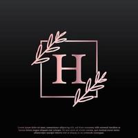 élégant logo floral carré de lettre h avec une branche de monogramme de feuille élégante créative et une couleur noire rose. utilisable pour les logos d'affaires, de mode, de cosmétiques, de spa, de science, de médecine et de nature. vecteur