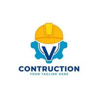 lettre initiale v avec équipement et casque. concept de logo de construction et d'ingénierie vecteur