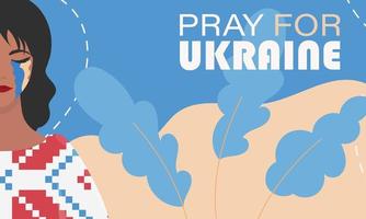 priez pour l'Ukraine. une fille pleure dans une chemise brodée sur fond de couleurs du drapeau ukrainien. bannière en faveur de l'ukraine. vecteur