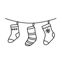 chaussettes de noël pour cadeaux sur corde. vecteur