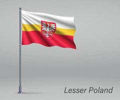 agitant le drapeau de la voïvodie de petite pologne - province de pologne sur vecteur