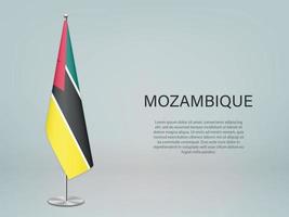 drapeau mozambicain suspendu sur pied. modèle de bannière de conférence vecteur