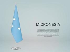 drapeau suspendu de la micronésie sur le stand. modèle de bannière de conférence vecteur