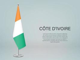 drapeau suspendu de la côte d'ivoire sur le support. modèle de bannière de conférence