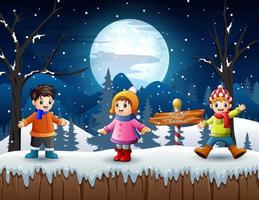 joyeux enfants jouant dans un paysage enneigé d'hiver vecteur