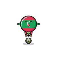 le mignon personnage du drapeau des maldives fait du vélo de cirque vecteur