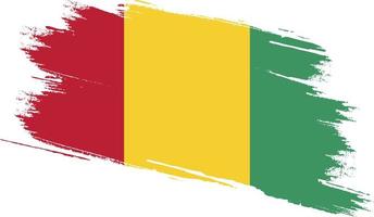 drapeau de la guinée avec texture grunge vecteur