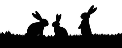 silhouette de trois lapins sur l'herbe vecteur