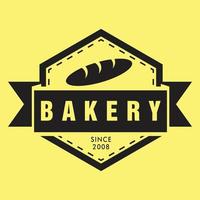 il s'agit d'un logotype emblème pour boulangerie ou boulangerie représentant un seul pain de couleur noire au milieu. il a l'air net et simple sur fond jaune.