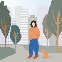 une jeune femme promène son chien bien-aimé dans un parc de la ville