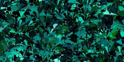texture vectorielle bleu foncé et vert avec des triangles aléatoires. vecteur