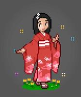 Les femmes de caractère 8 bits pixels portent une robe kimono. pixels de fille adulte dans les illustrations vectorielles pour les actifs de jeu ou les motifs de point de croix. vecteur
