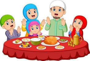 une famille heureuse prie pour manger la nourriture sur le ied mubarak vecteur
