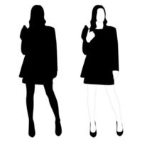 le contour d'une silhouette noire et blanche d'une fille élégante et mince dans un costume à la mode debout. modèle adulte.